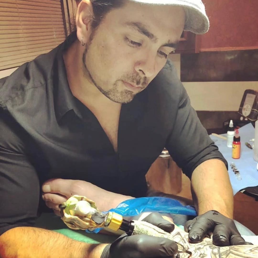 Tattoo artist at work in Pirates Studio, Torrevieja